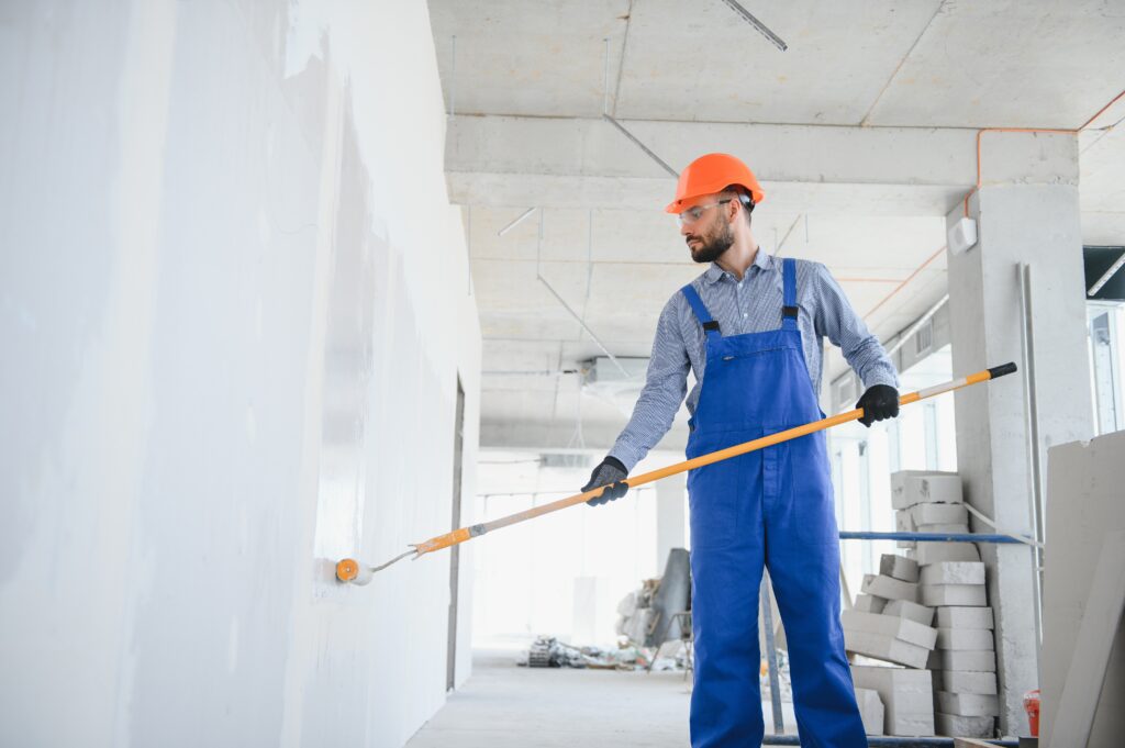 commercial painter with large roller